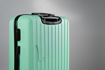 Close-up of a broken suitcase on a white background. Damaged baggage during the flight.
