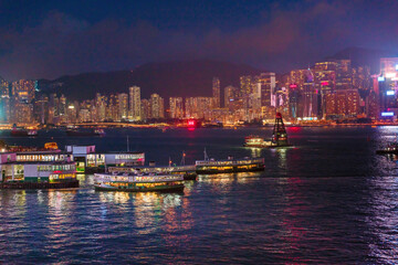 Obraz premium Vessel of Star Ferry sailing across the VIctoria Harbour at night