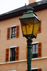 Fototapeta na wymiar Beautiful old street lamp in Annecy-le-Vieux, historical city centre of Annecy, Haute Savoie, France