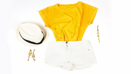 Women's casual summer clothes with elements of accessories on white background, top view, flat lay