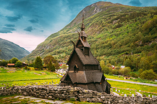Borgund, Norway. Famous Landmark Stavkirke An Old Wooden Triple Nave Stave Church In Summer Day. Ancient Old Wooden Worship In Norwegian Countryside Landscape
