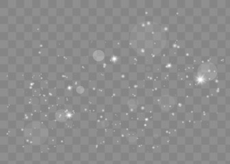 The dust sparks and golden stars shine with special light. Vector sparkles on a transparent background. Christmas light effect.