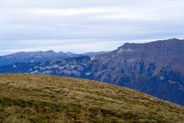 Mountain panorama seen from Axalp at Bernese Highlands on a grey cloudy autumn day. Photo taken October 19th, 2021, Brienz, Switzerland.