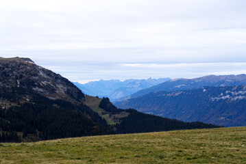 Fototapeta premium Mountain panorama seen from Axalp at Bernese Highlands on a grey cloudy autumn day. Photo taken October 19th, 2021, Brienz, Switzerland.