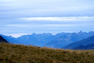 Fototapeta na wymiar Mountain panorama seen from Axalp at Bernese Highlands on a grey cloudy autumn day. Photo taken October 19th, 2021, Brienz, Switzerland.