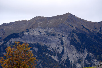 Naklejka na ściany i meble Mountain panorama seen from Axalp at Bernese Highlands on a grey cloudy autumn day. Photo taken October 19th, 2021, Brienz, Switzerland.