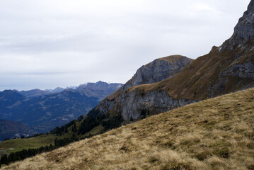 Mountain panorama seen from Axalp at Bernese Highlands on a grey cloudy autumn day. Photo taken October 19th, 2021, Brienz, Switzerland.