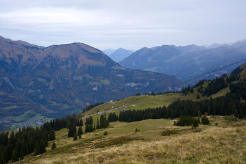 Fototapeta premium Mountain panorama seen from Axalp at Bernese Highlands on a grey cloudy autumn day. Photo taken October 19th, 2021, Brienz, Switzerland.