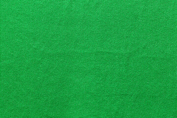 Green color sports clothing fabric football shirt jersey texture and textile background.