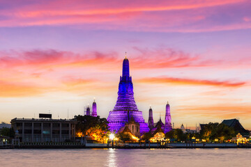 Wat Arun and Chao Phraya River with beautiful sunset sky background, Bangkok
