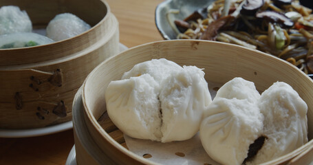 Chinese restaurant dim sum in bamboo basket, Barbecued Pork Bun