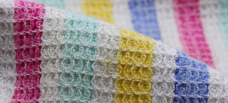 close-up of a knitted fabric background. Colorful kitchen cloth