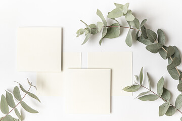 Styled summer wedding desktop stationery mockup. Blank greeting and invitation card. Green tropical leaves with empty space.