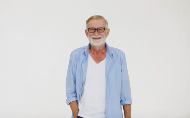 Portrait shot of happy Caucasian old senior gray bearded male grandfather looking at camera smiling standing  in casual wears and eyeglasses isolated on white background