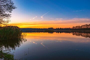 Golden hour and sunset over the Narew River in the autumn time