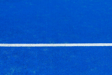 Fototapeta na wymiar Blue paddle tennis court. Blue court with white lines. Horizontal sport poster, greeting cards, headers, website.