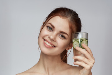 woman with cucumber drink health vitamins close-up