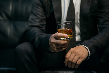 man holding a glass of wine