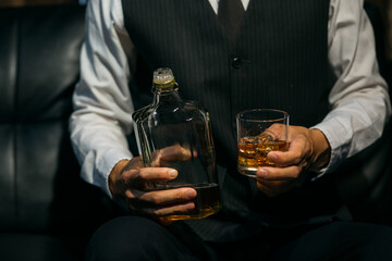 Businessmen in suits drinking whiskey