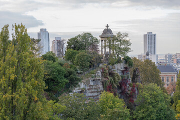 Fototapeta premium Paris, France - 10 23 2021: Park des Buttes Chaumont. View of the Temple of the Sibyl in the belvedere Island