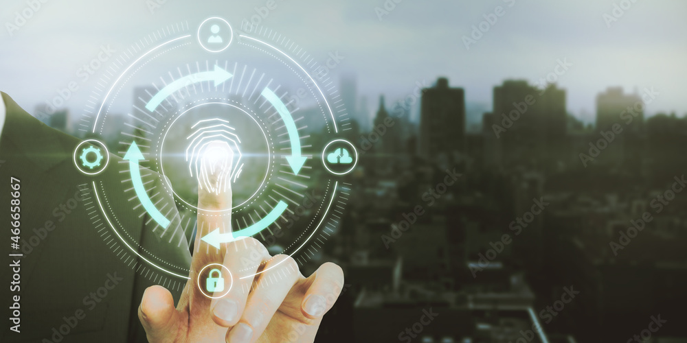 Poster close up of male hand pointing at abstract glowing fingerprint id scanning interface on blurry city 