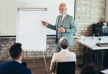 Speaker at business workshop and presentation. Audience at the conference room.