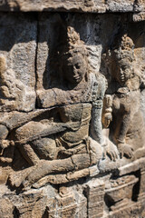 Fototapeta na wymiar 23 May 2008, Magelang, Java, Indonesia: Panel Relief on Borobudur Temple, Indonesia