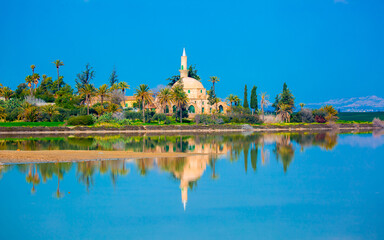 The ancient mosque Hala Sultan Tekkes on the shore of the salt lake in Cyprus in Larnaca, the...