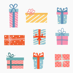 Set of colorful gift boxes with ribbons on white background. Flat design for a Christmas gift. Vector illustration.