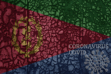 flag of eritrea on a old metal rusty cracked wall with text coronavirus, covid, and virus picture.