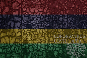 flag of mauritius on a old metal rusty cracked wall with text coronavirus, covid, and virus picture.