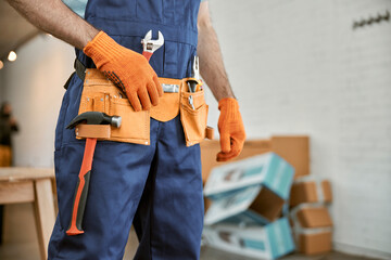 Male worker wearing tool belt with instruments - obrazy, fototapety, plakaty