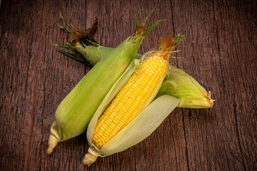 Sweetcorn in wooden background, Corn on a wooden table background.