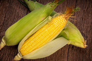Sweetcorn in wooden background, Corn on a wooden table background.