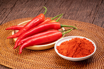 Korean pepper and red pepper in wooden plate, Korean chili powder on a wooden table background.