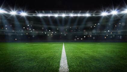 Fototapeta na wymiar textured free soccer field in the evening light - center, midfield