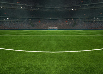 green field in soccer stadium. ready for game in the midfield