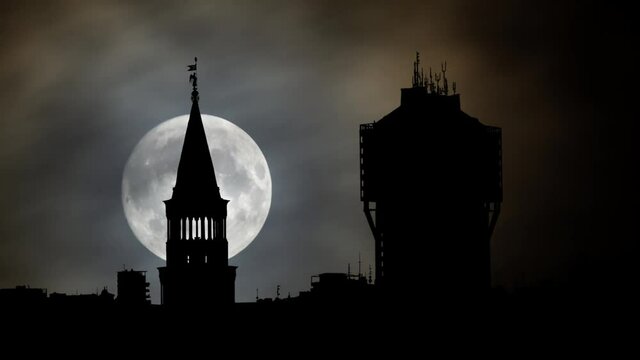 View of Milan by Night, Time Lapse with Full Moon and Velasca Tower (Torre Velasca) in Silhouette, Italy