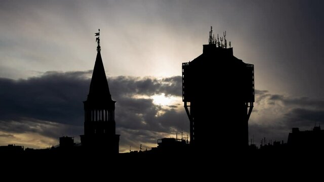 Torre Velasca and Milan skyline from Duomo roof terrace, Time Lapse at Sunrise with Fast Clouds, Italy