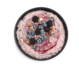 Tasty oatmeal porridge with different toppings in bowl on white background, top view