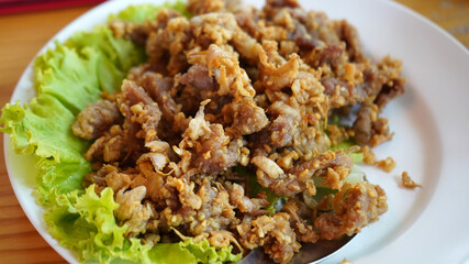The favourite Thai food, deep fried garlic pork.     
