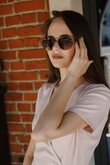 young woman in beige dress on the street