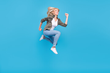 Plakat Full length body size photo woman jumping running on sale isolated pastel blue color background