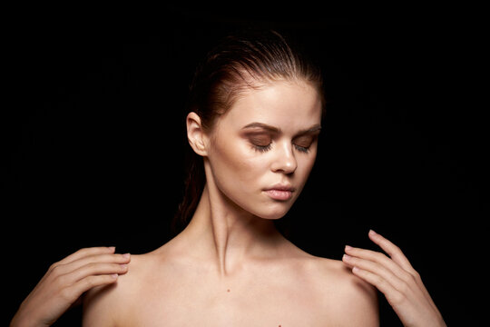 woman model emotions gesture hands bare shoulders dark background