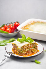 Homemade  green lasagna - Lasagne alla bolognese with spinach in the dough, ragu - meat sauce,...