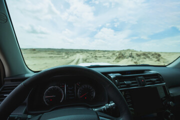 Driving off road car in the desert