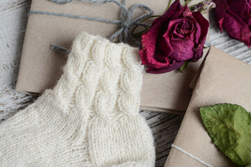 Packing Christmas gifts, on white wooden table