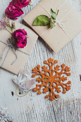 Packing Christmas gifts, on white wooden table