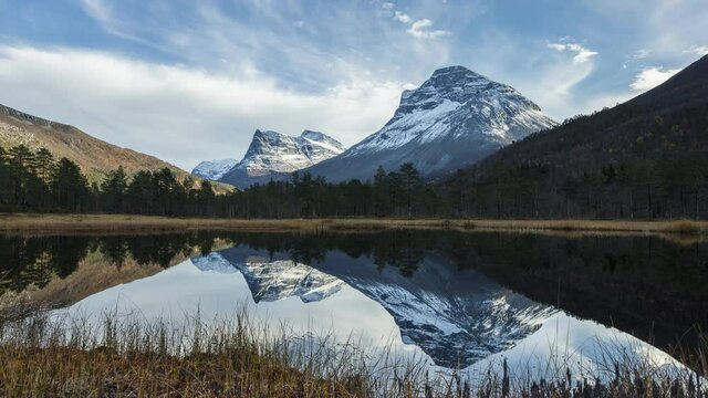 A timelapse of Innerdalen-the most beautiful mountain valley in Norway and reflection in a lake in 4K
