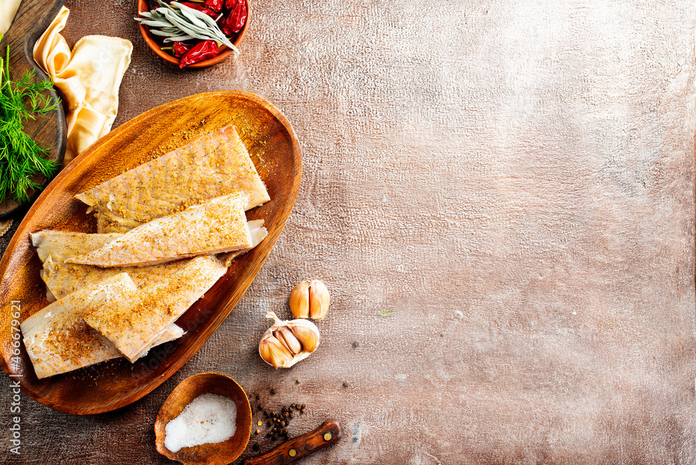 Sticker fish fillet on a woodentray. white fish prepare for cooking